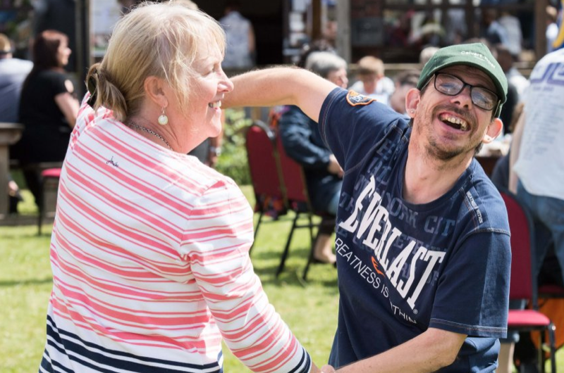 Resident dancing with friend