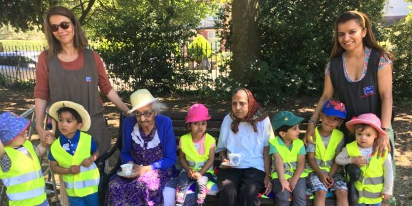 Group of children and residents smiling