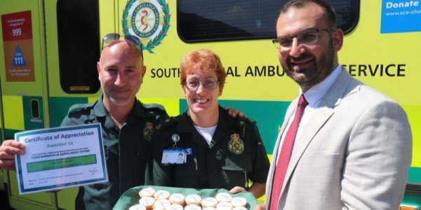 Ambulance staff with home manager Antonios