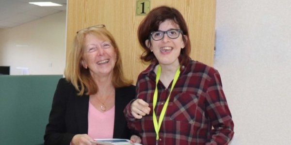 Lucy greeting people on induction