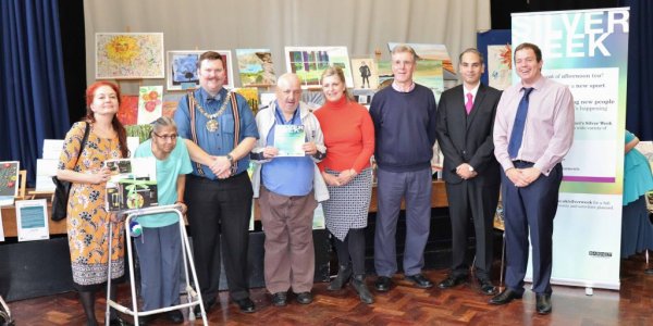 Residents collecting their prizes in the Silver Week art competition