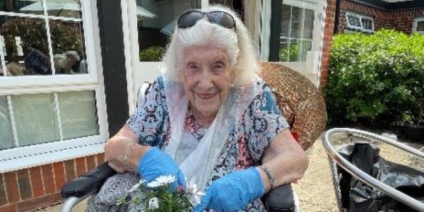 A resident gardening at Sir Aubrey Ward Marlow