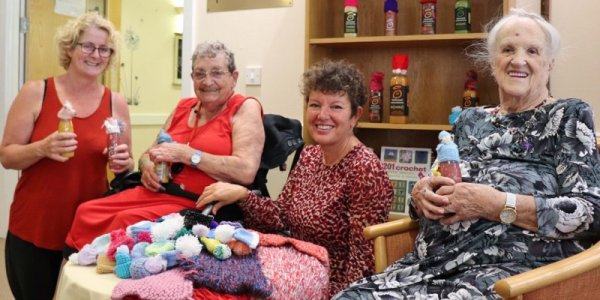 Residents and Age UK CEO and The Fremantle Trust CEO smiling at camera