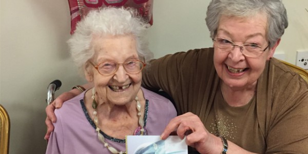 Hilda holding birthday card from HM Queen