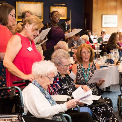 Group photo of residents and the Chesham Leys care team singing