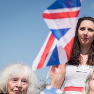 Residents waving flags