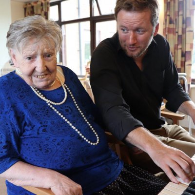 Brenda and Phil sat at the piano