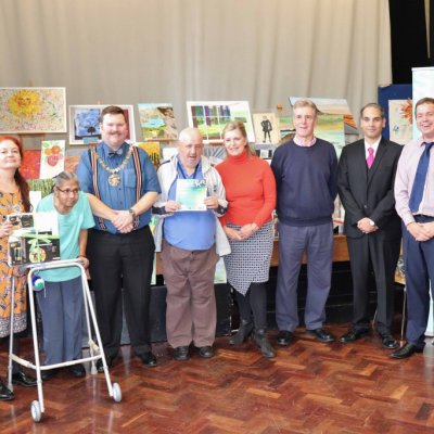 Residents collecting their prizes in the Silver Week art competition