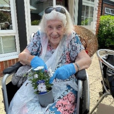 A resident gardening at Sir Aubrey Ward Marlow