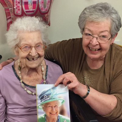 Hilda holding birthday card from HM Queen